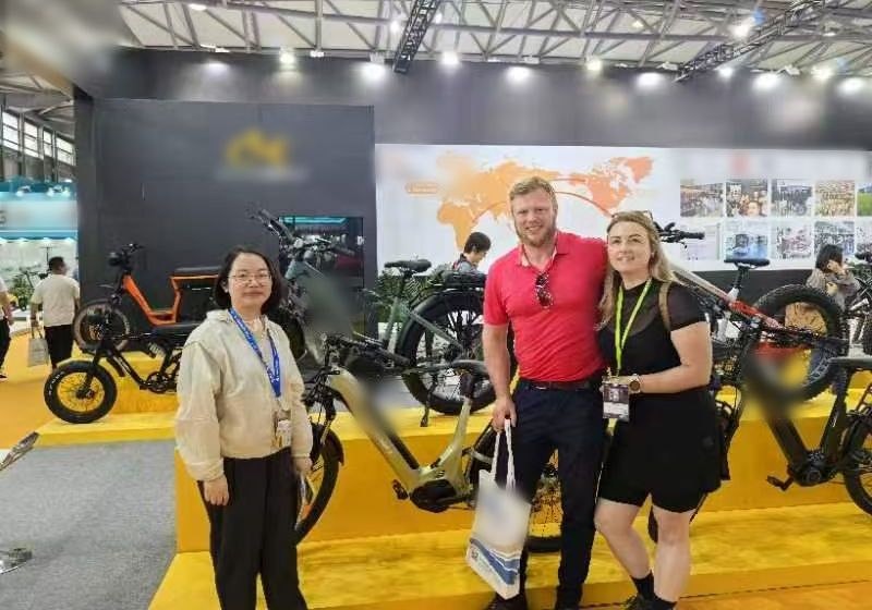 Joe Lindsay at a factory's stand at a trade show in China